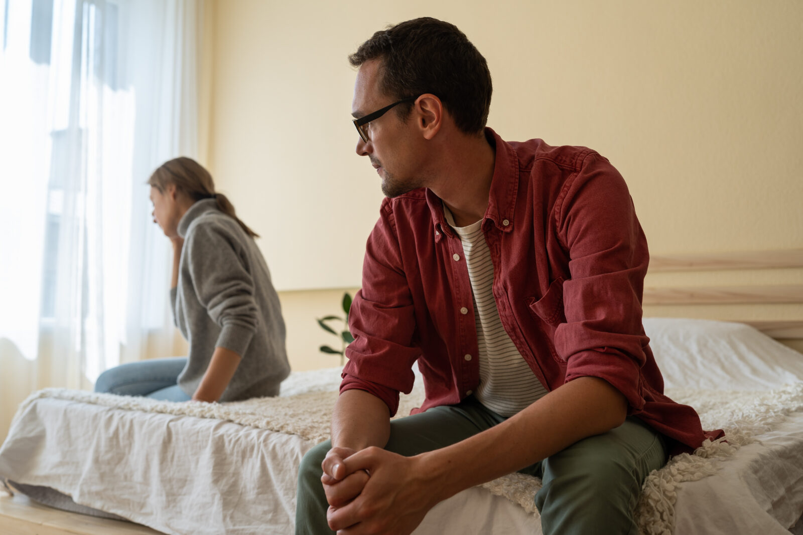 Couple sitting in silence after a difficult conversation